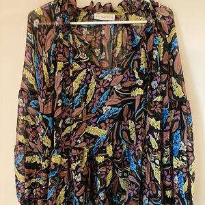 Colorful, floral billowy boutique blouse. Size Medium, but can fit a large.